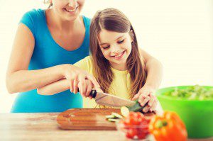 mother and daughter cooking