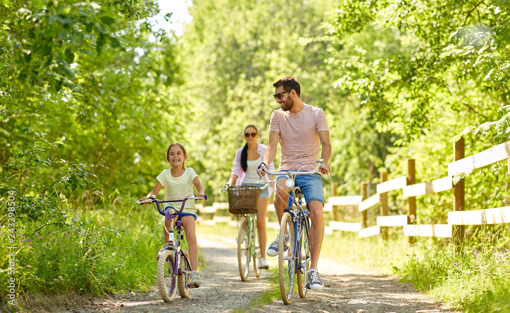 Family Riding on Bikes near the river