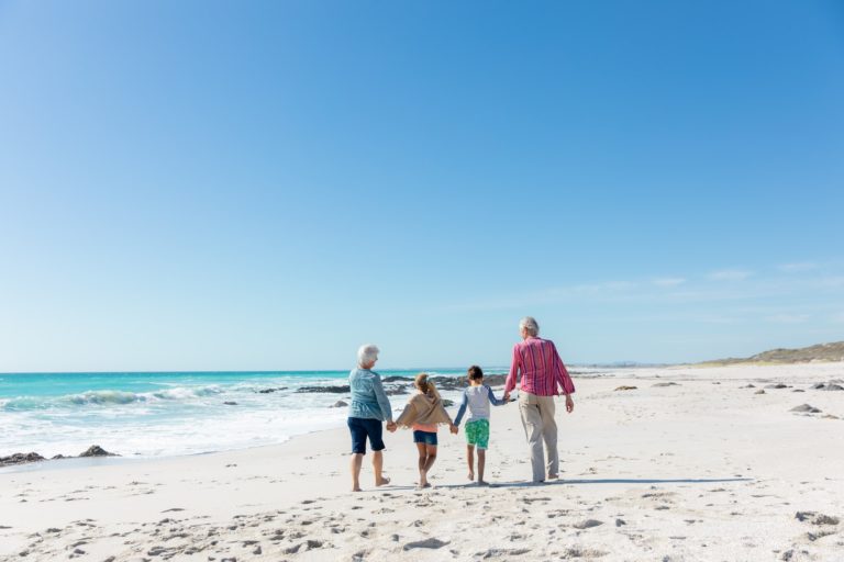 Grandparents and grandchildren at the beach