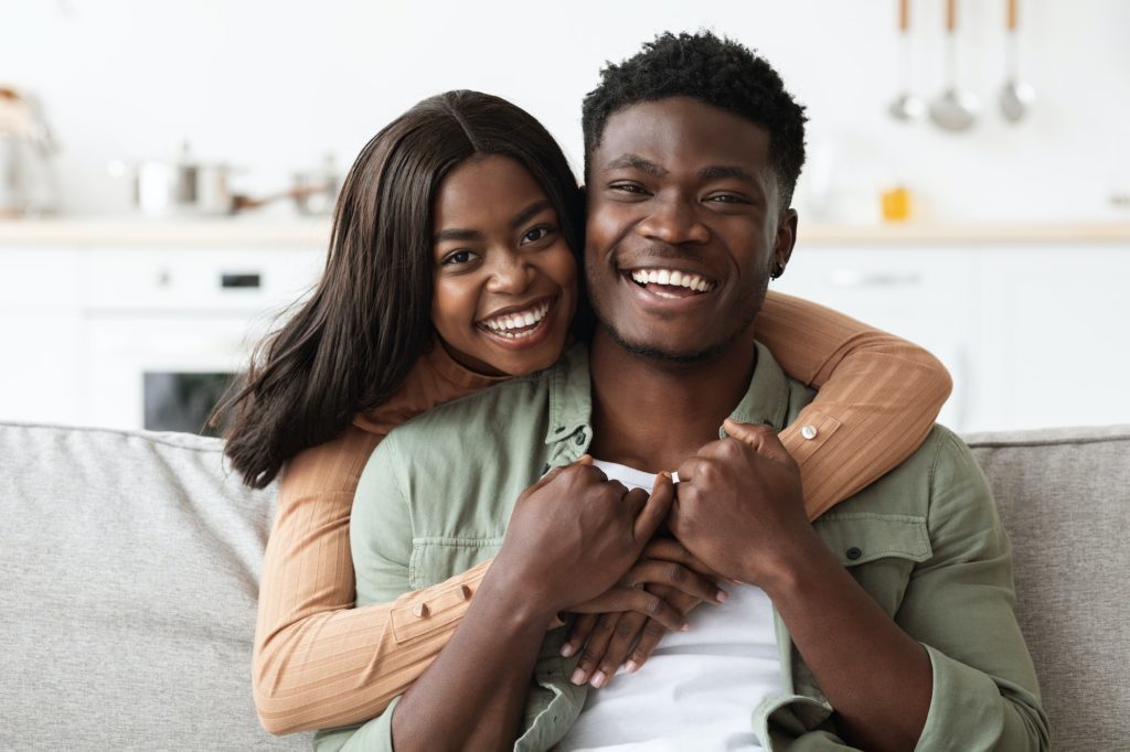 Portrait of happy african american family spending weekend at home