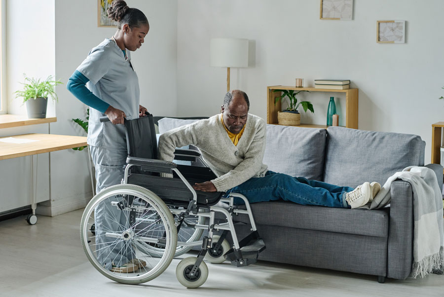 social worker caring about man with disability 2022
